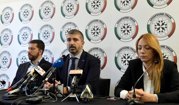 CasaPound Vice President Simone Di Stefano (C) speaks at a press conference at CasaPound's headquarters in Rome on Nov. 9, 2017. Reporter Daniele Piervincenzi was asking the brother of a famous mafia boss about his ties to the CasaPound movement when he was attacked on camera in Ostia. (TIZIANA FABI/AFP/Getty Images)