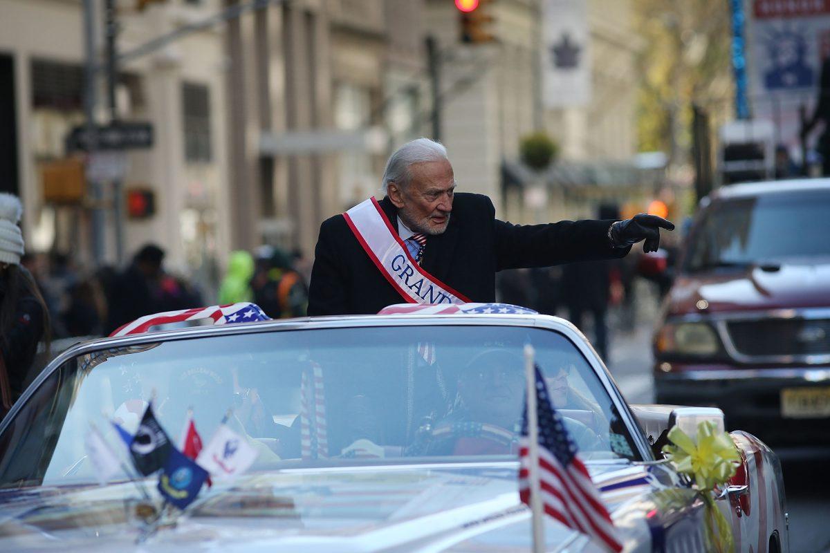 Grand Marshal space pioneer Buzz Aldrin drives up Fifth Avenue in a convertible during the Veterans Day Parade in New York on Nov. 11, 2017. (Spencer Platt/Getty Images)