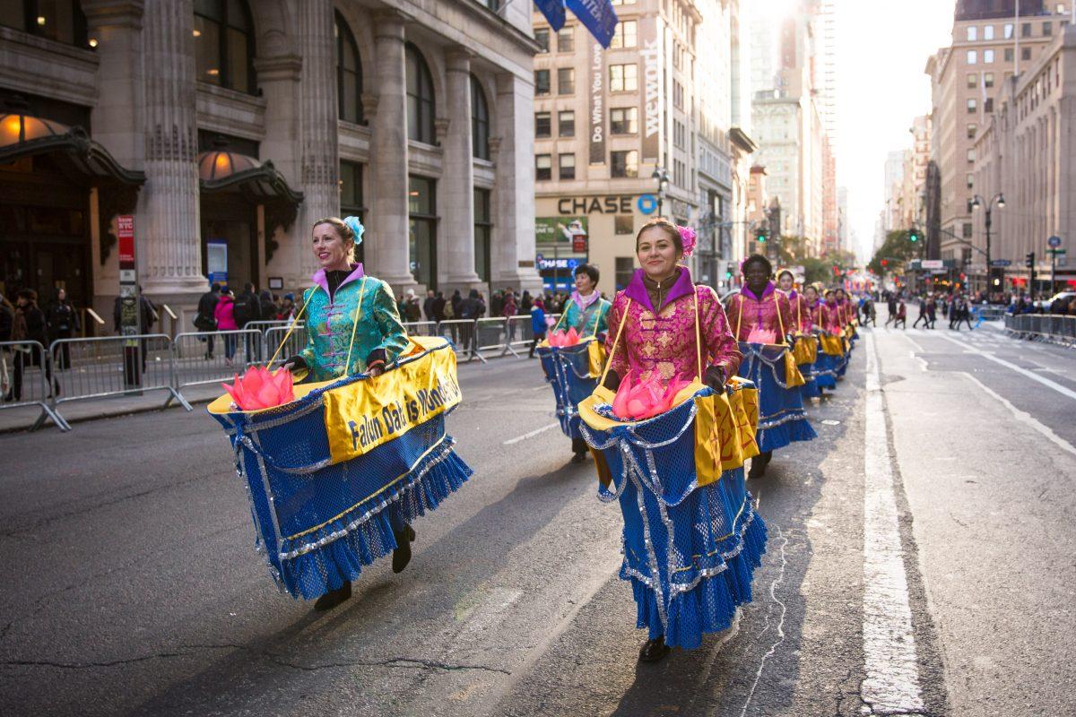 Falun Gong practitioners march in the in the Veterans Day Memorial parade in New York on Nov. 11, 2017. (Benjamin Chasteen/The Epoch Times)