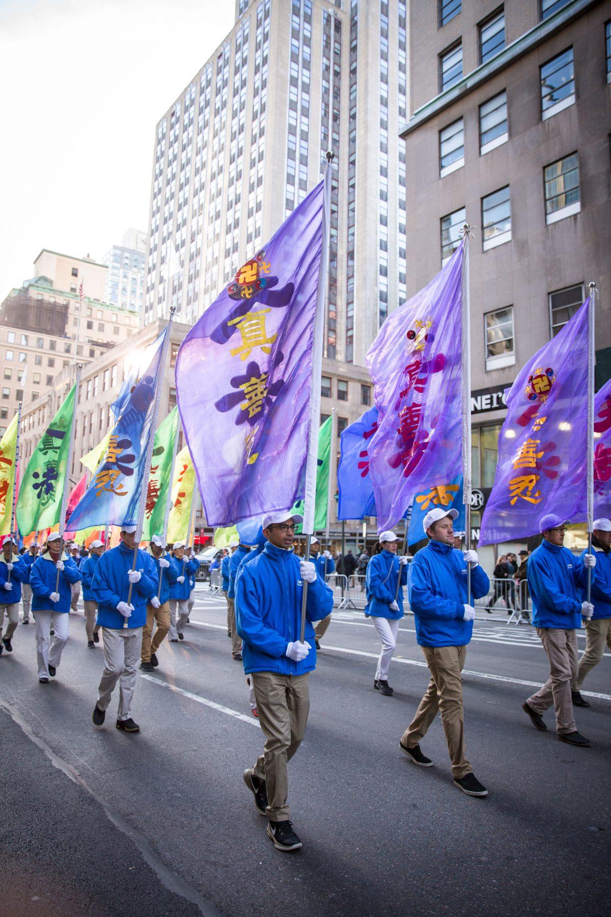 Falun Gong practitioners march in the in the Veterans Day Memorial parade in New York on Nov. 11, 2017. (Benjamin Chasteen/The Epoch Times)