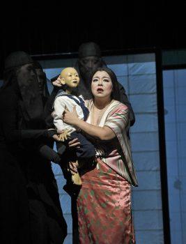 Hui He as Cio-Cio-San and a bunraku puppet as her 3-year-old son, with two handlers. (Ken Howard/Metropolitan Opera)