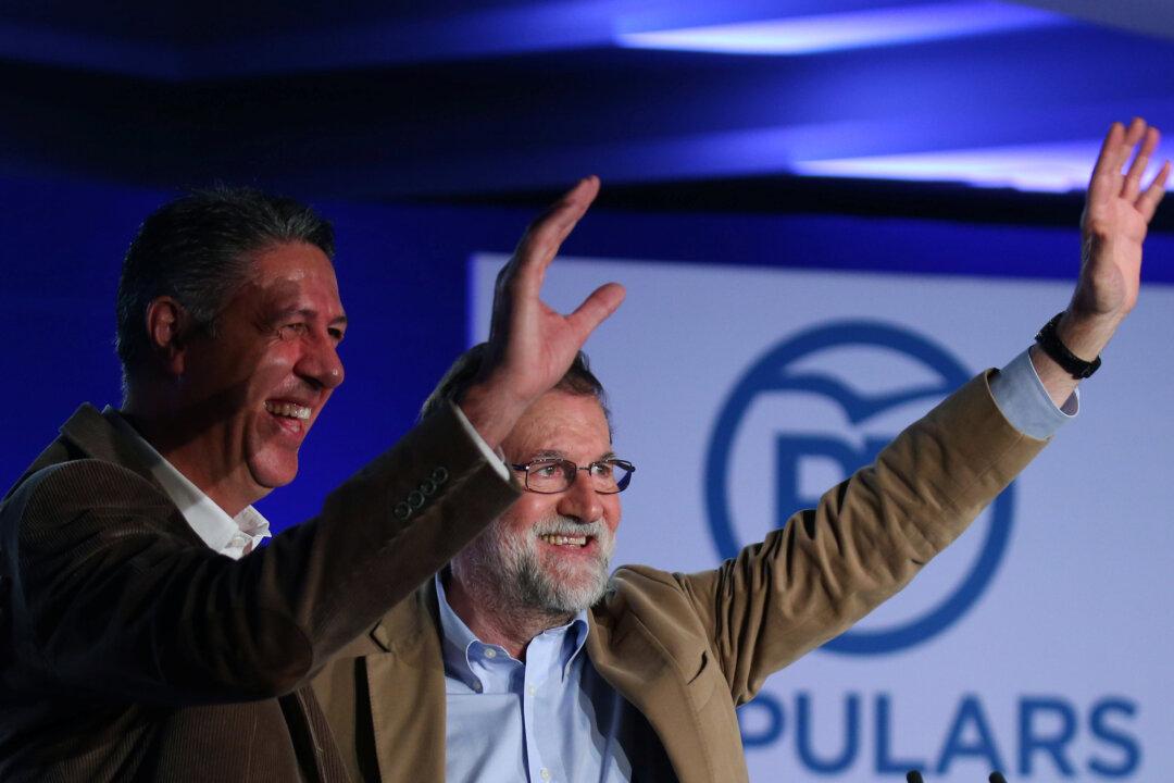 Spanish PM, in Catalonia, Calls for Big Turnout at December Election