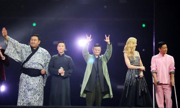 Founder and executive chairman of Alibaba Jack Ma (C) as he greets spectators with Mongolia's former sumo wrestler Dagvadorj Dolgorsurengiin (L), Hong Kong actor Donnie Yen (2L), Australian actress Nicole Kidman (2R), and Chinese actor Wu Jing (R), during the company's Nov. 11 shopping festival gala in Shanghai. (STR/AFP/Getty Images)