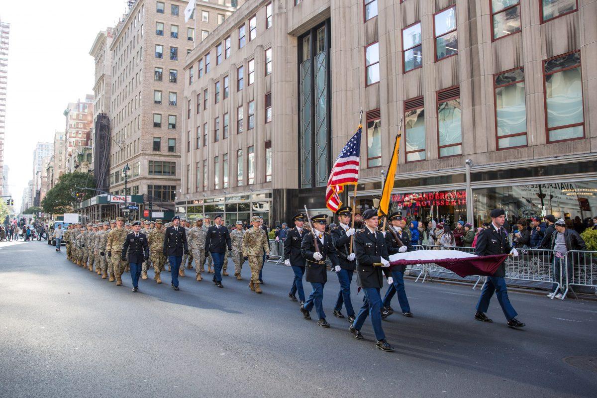 Soldiers, veterans and civilians march in the Veterans Day Parade in New York on Nov. 11, 2017. The parade is the the largest Veterans Day event in the nation, as this year's parade featured thousands of marchers from military units, civic and youth groups, businesses and high school bands from across the country and veterans of all eras. (Benjamin Chasteen/The Epoch Times)