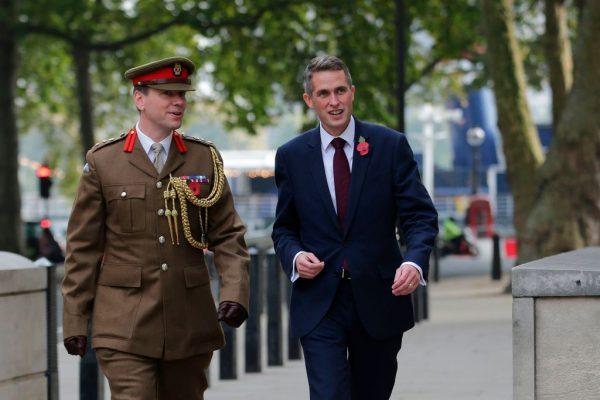 Britain's newly appointed Defence Secretary Gavin Williamson (R) walks with Military Adviser Colonel John Clark (L) outside the Ministry of Defence in central London on November 2, 2017. (Daniel Leal-Olivas/AFP/Getty Images)