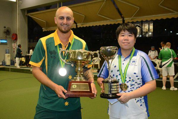 Jesse Noronha from Australia (left) and Vivian Yip from Hong Kong Football Club happily carrying their singles trophy of the Hong Kong International Bowls Classic after winning their respective finals on Sunday, Nov 12, at Club de Recreio. (Stephanie Worth)