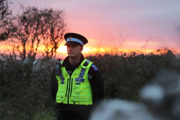 A police officer attends the scene of a search for missing teenager Gaia Pope along the coastal path near Langton Matravers on November 16, 2017 in Swanage, England. (Matt Cardy/Getty Images)