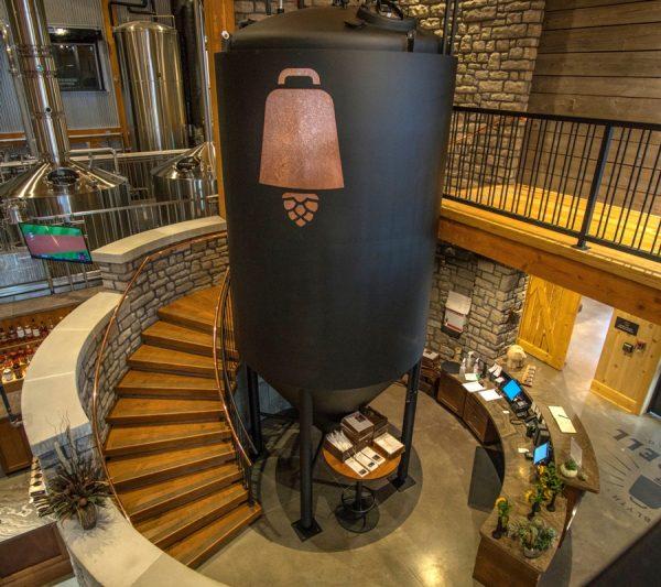 The spiral staircase at Cowbell winds around a beer tank. (Cowbell Brewing Co.)