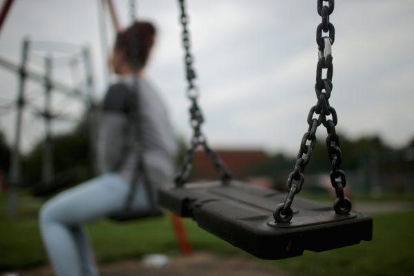 A teenage girl, who claims to be a victim of sexual abuse and alleged grooming, poses in Rotherham, South Yorkshire on Sept. 3, 2014. (Christopher Furlong/Getty Images)