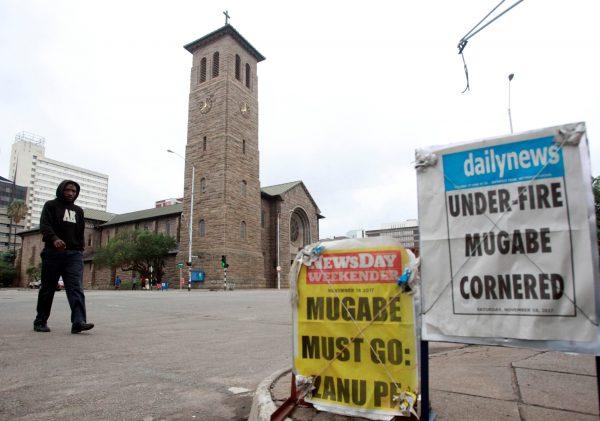 Newspaper billboards are seen in Harare, Zimbabwe November 18, 2017. (Reuters/Philimon Bulawayo)