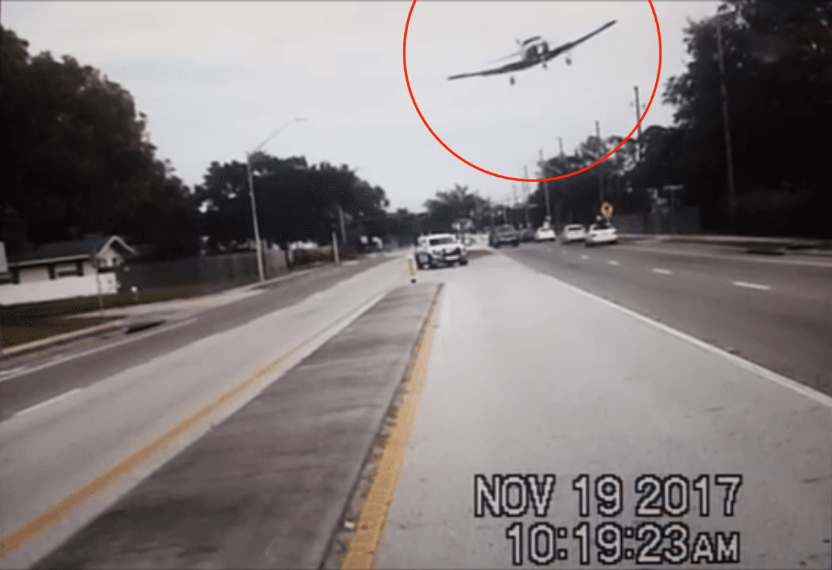 The dashboard camera in a patrol car records the dramatic final descent of the four-seater 1975 Rockwell International 112A fixed-wing aircraft above Keene Road North in Clearwater, Fla., on Sunday, Nov. 19. (Pinellas County Sheriff's Office)