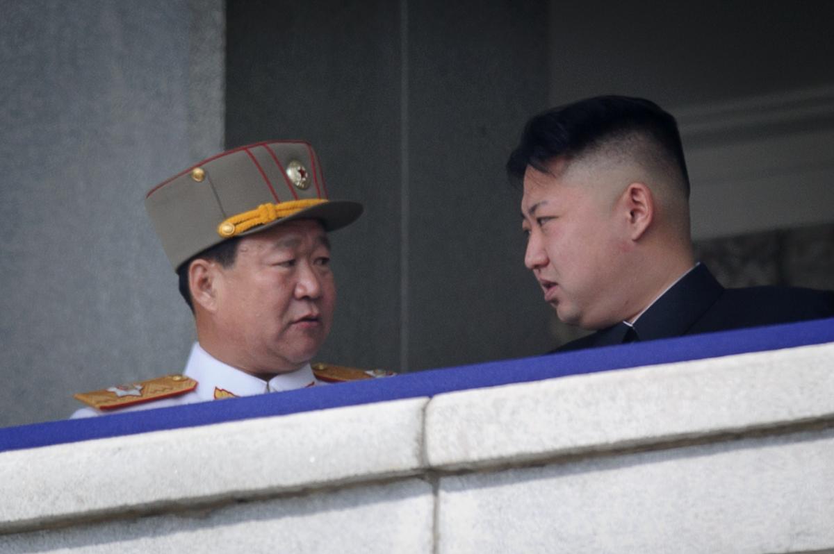 A photo taken on April 15, 2012, shows a man believed to be Choe Ryong Hae talking with North Korean leader Kim Jong Un at a military parade in Pyongyang. Hwang replaced Choe as the political chief of the military in 2014, but reports indicate it was Choe that investigated Hwang’s alleged ‘impurity.’<span class="Apple-converted-space">  </span>(AFP/AFP/Getty Images)