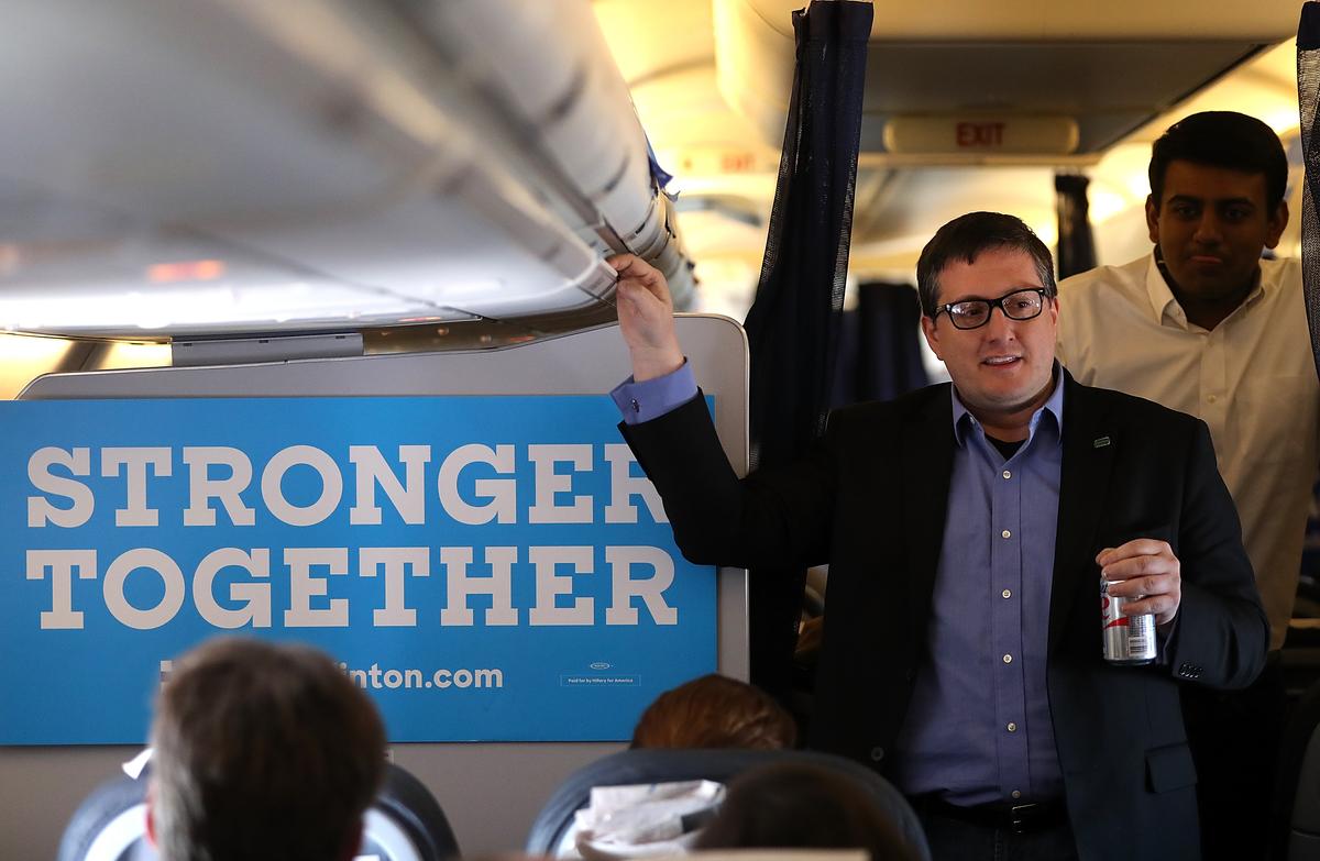 Philippe Reines, campaign adviser to Democratic presidential nominee Hillary Clinton, speaks to members of the traveling press aboard the campaign plane on Nov. 2, 2016, while traveling to Las Vegas. (Justin Sullivan/Getty Images)