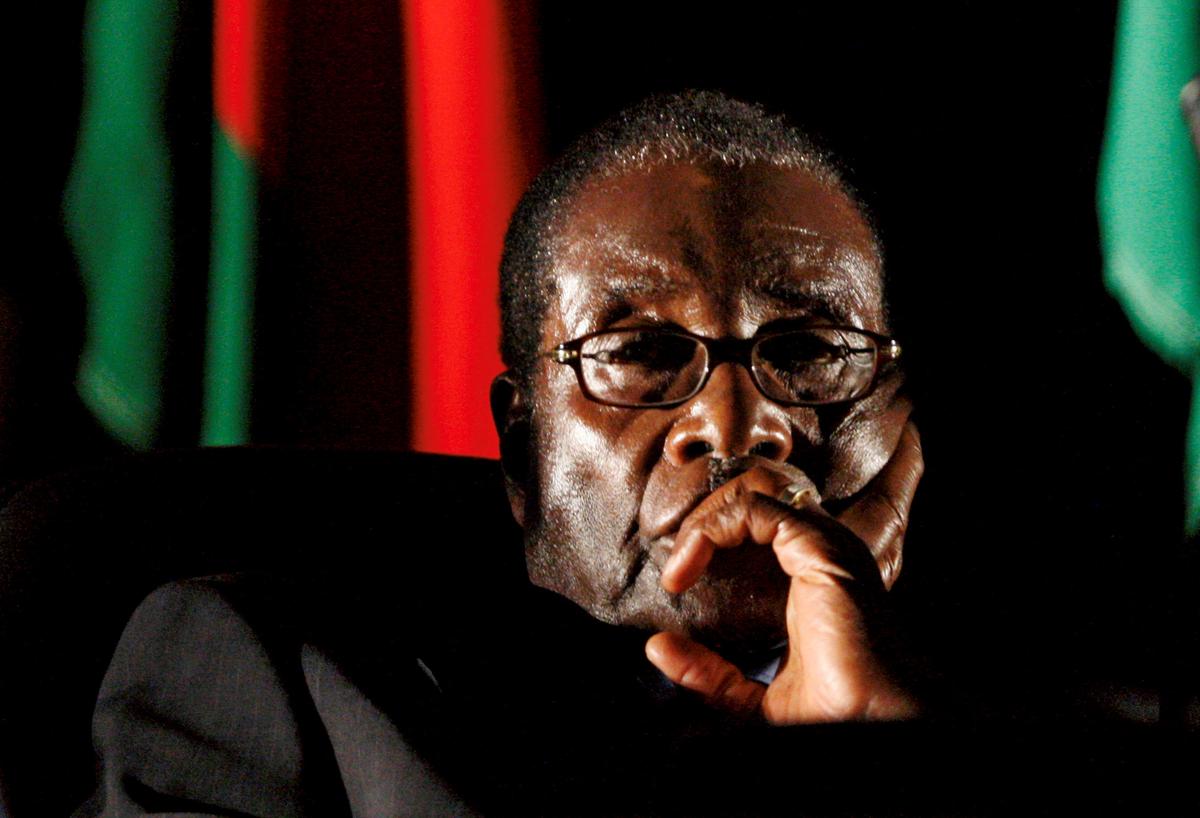 Zimbabwean President Robert Mugabe watches a video presentation during the summit of the Southern African Development Community (SADC) in Johannesburg, South Africa August 17, 2008. (Reuters/Mike Hutchings/File Photo)