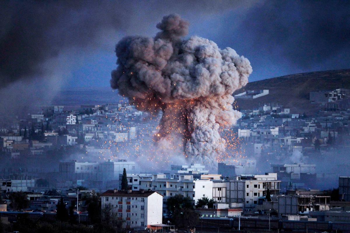 An image showing a suicide car bomb attack by ISIS in Kobani, Syria. (Gokhan Sahin/Getty Images)