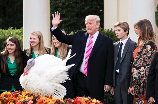 President Donald Trump is joined by girls from the Draper County, Minn., 4-H chapter (R), and First Lady Melania Trump and their son Barron, during the annual Thanksgiving Turkey Pardon in the Rose Garden in Washington on Nov. 21, 2017. (Samira Bouaou/The Epoch Times)