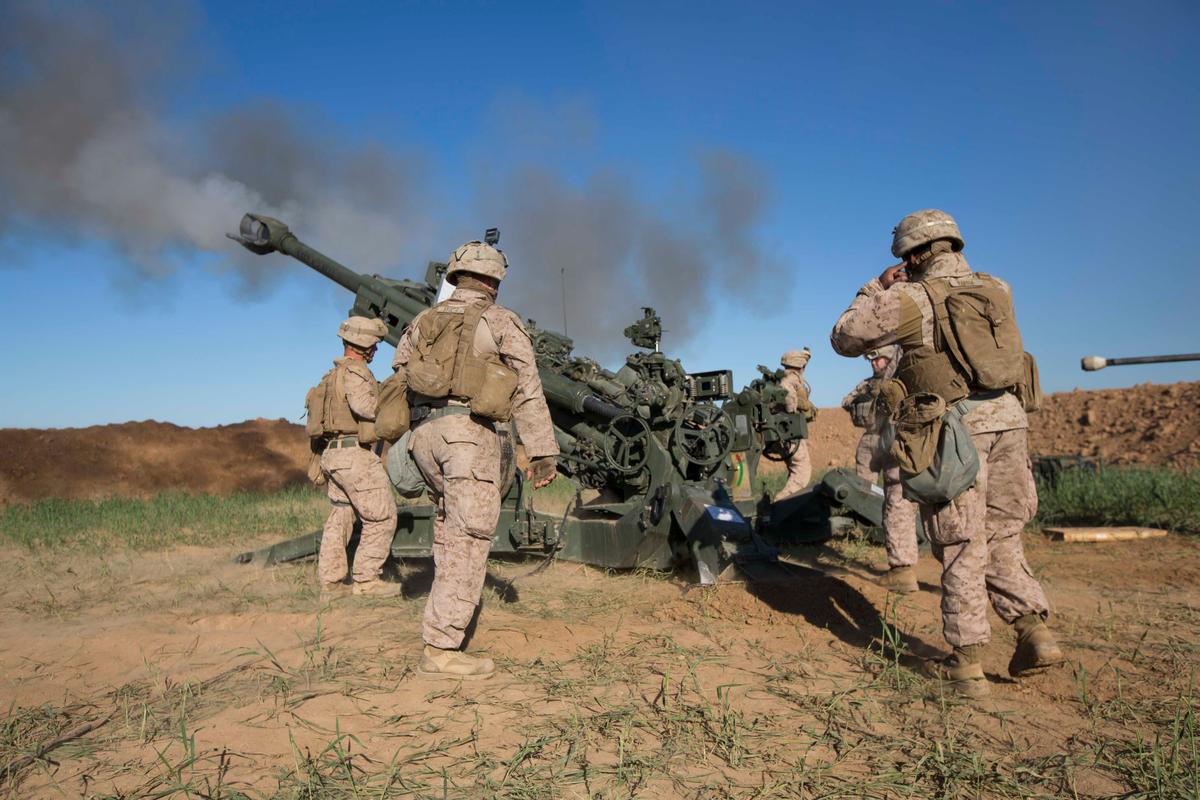 Marines fire a M777A2 Howitzer on an ISIS infiltration route in support of Operation Inherent Resolve in Iraq on March 18, 2016. (U.S. Marine Corps photo by Cpl. Andre Dakis/26th MEU Combat Camera/FOUO)