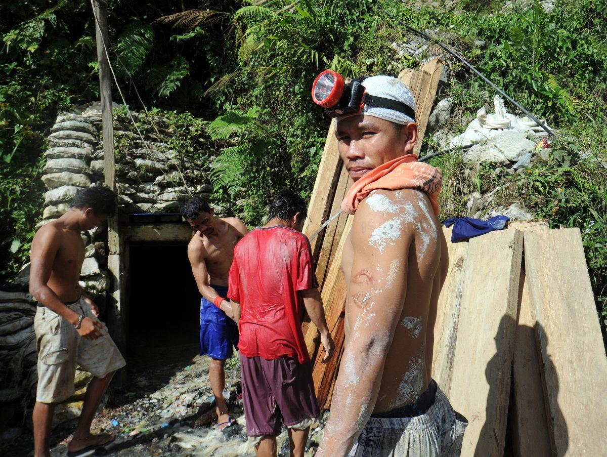 Miners wash themselves down next to an abandoned mine tunnel at the village of Mt. Diwata in the Compostela Valley on the southern Philippine island of Mindanao, July 17, 2012. In 2012, then President Benigno Aquino announced mining reforms that his government said would better regulate a chaotic industry, improve environmental standards and deliver a bigger share of revenues to state coffers. Part of the planned reforms would ensure more strict government supervision of places such as Mount Diwata, a product of a unique Philippine law dating back decades that allows individual miners to set up their own operations. (Ted Aljibe/AFP/GettyImages)