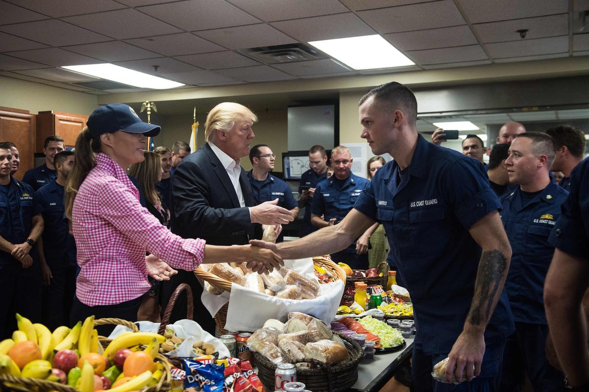 President Donald Trump and First Lady Melania Trump visit members of the U.S. Coast Guard at Station Lake Worth Inlet in Riviera Beach, Florida on Thanksgiving, Nov. 23, 2017. (NICHOLAS KAMM/AFP/Getty Images)
