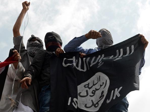 Kashmiri demonstrators hold up a flag of ISIS of Iraq and the Levan i nJuly 20014. (Photo credit should read Tauseef Mustafa/AFP/Getty Images)