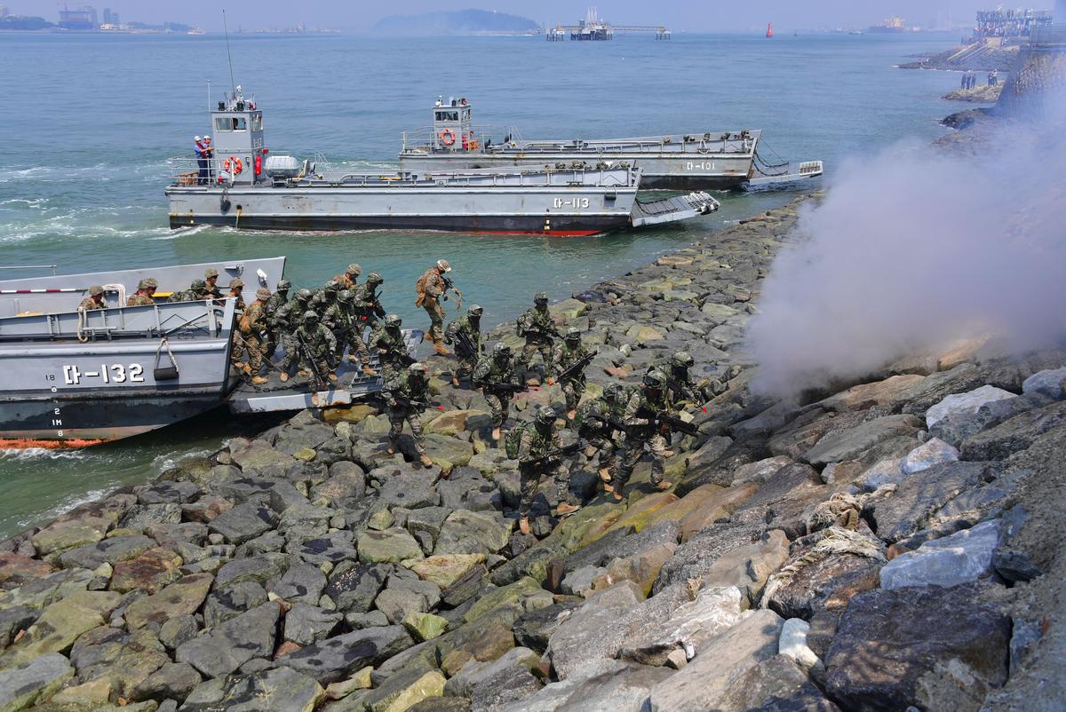 South Korean and U.S. Marines land on the seashore during a re-enactment of the Incheon landing to mark the 66th anniversary of the battle that turned the tide in the Korean War, in the western port city of Incheon on Sept. 9, 2016. The daring Incheon Landing was led by U.S. General Douglas MacArthur and led two weeks later to the recapture of Seoul from North Korean invaders during the Korean War. (JUNG YEON-JE/AFP/Getty Images)