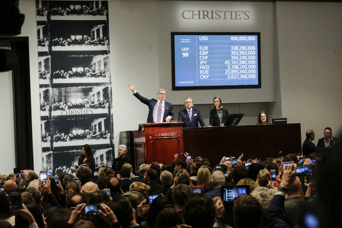 Auctioneer Jussi Pylkkanen takes bids at the auction of Leonardo da Vinci's "Salvator Mundi" during the Post-War and Contemporary Art evening sale at Christie's in New Yorkon Nov. 15, 2017. (Eduardo Munoz Alvarez/Getty Images)