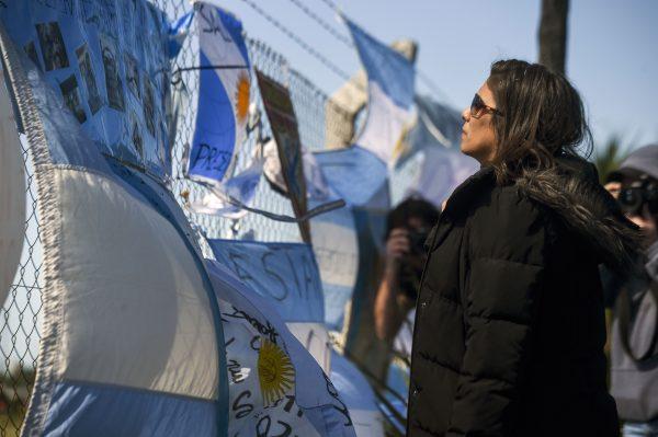 A relative of missing submariner Celso Oscar Vallejos looks at supportive messages for the 44 crew members of Argentine missing submarine hanging outside Argentina's Navy base in Mar del Plata, on the Atlantic coast south of Buenos Aires, on Nov. 23, 2017. (Eitan Abramovich/AFP/Getty Images)