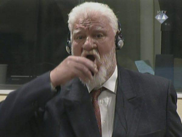 A wartime commander of Bosnian Croat forces, Slobodan Praljak, is seen during a hearing at the U.N. war crimes tribunal in The Hague, Netherlands, on Nov. 29, 2017. (ICTY via Reuters TV)