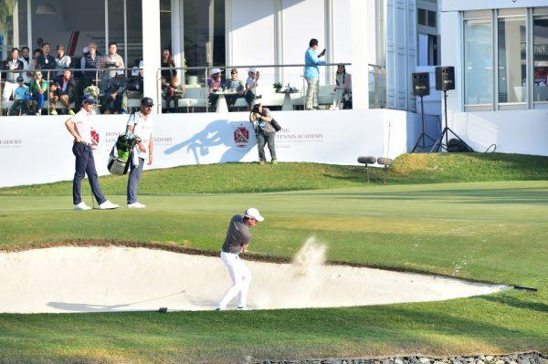 Alexander Bjork of Sweden hits out of the bunker on the 18th hole at Fanling Golf Club on the final day of the UBS Hong Kong Golf Open,2017, subsequently 2 putting to finish at 10 under par for the tournament. (Bill Cox/Epoch Times)