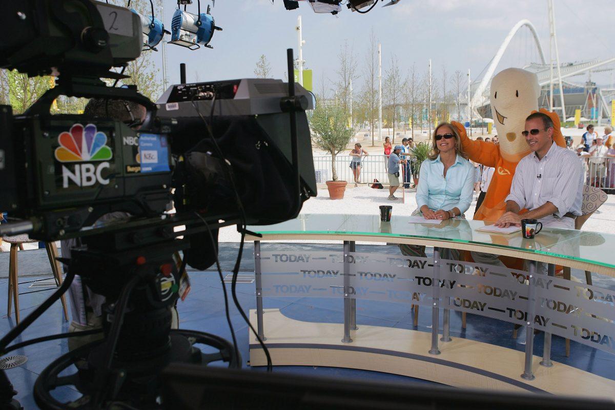 Katie Couric and Matt Lauer get a visit from the Athens 2004 Olympic mascot Athena on the set of NBC's "Today" show on Aug. 12, 2004 in Athens, Greece. (Scott Gries/Getty Images)