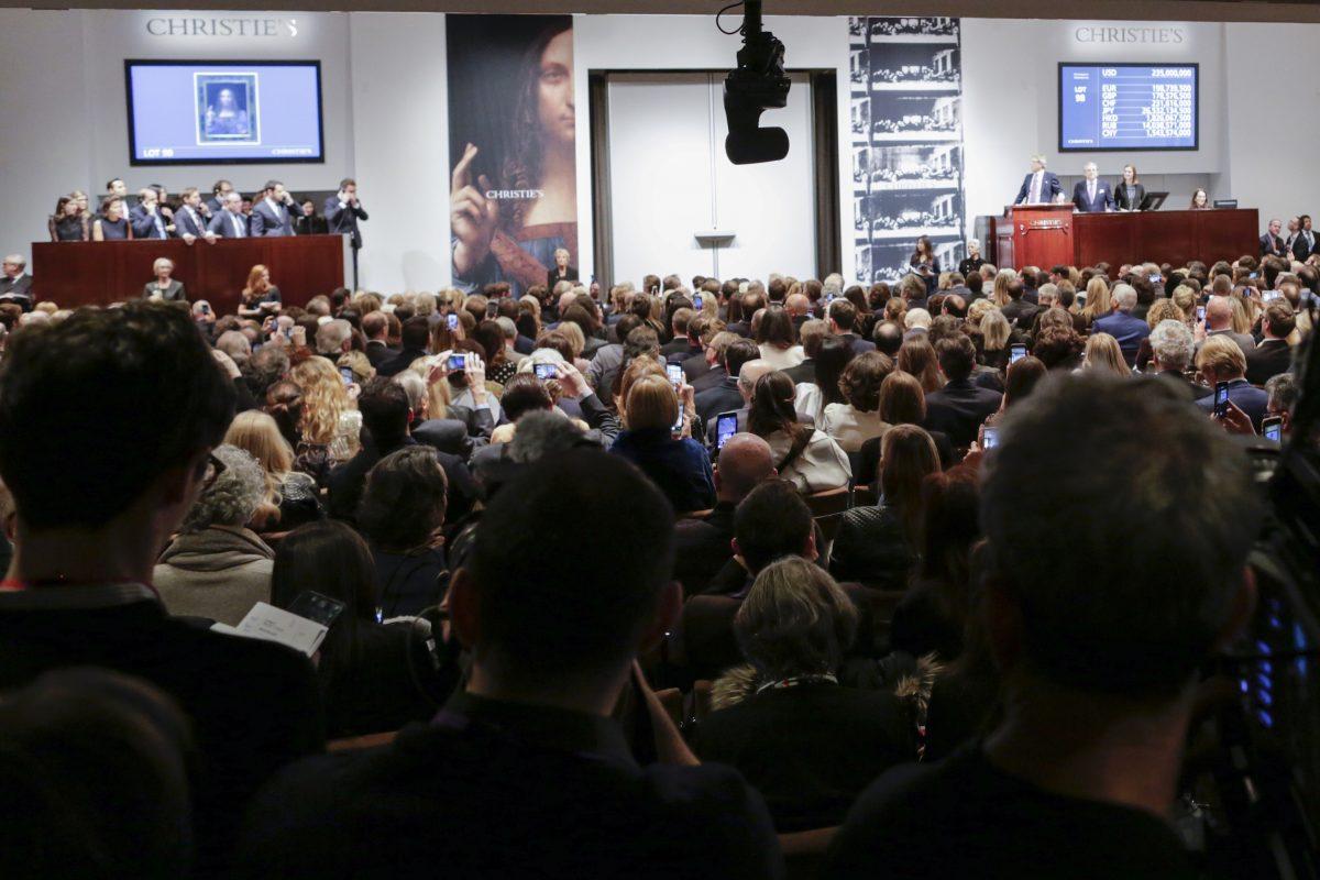 People attend the auction of Leonardo da Vinci's "Salvator Mundi" during the Post-War and Contemporary Art evening sale at Christie's on Nov. 15, 2017 (Eduardo Munoz Alvarez/Getty Images)