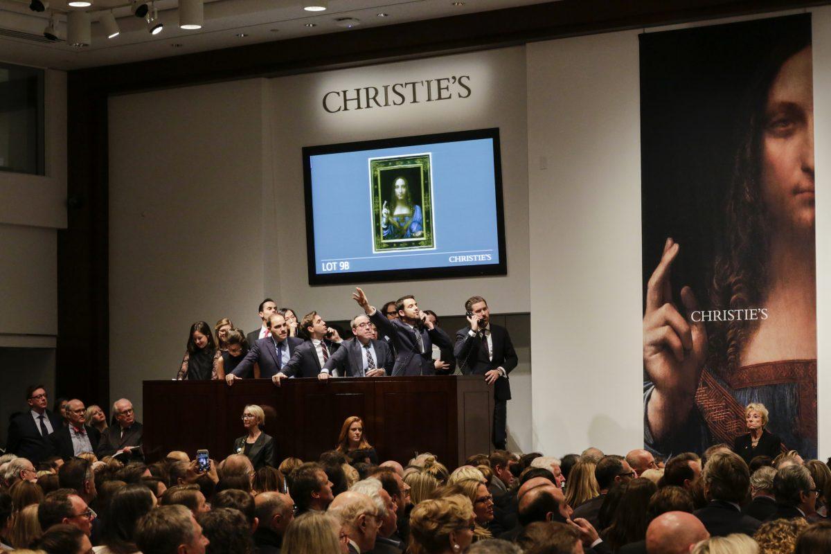 Agents speak on their phones with their clients while bidding on at the auction of Leonardo da Vinci's "Salvator Mundi" during the Post-War and Contemporary Art evening sale at Christie's on Nov. 15, 2017. (Eduardo Munoz Alvarez/Getty Images)