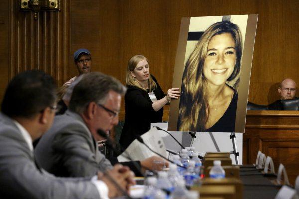 A photo of Kate Steinle (R) is placed on an easel as her father Jim Steinle (2nd L) prepares to testify about her death during a Senate Judiciary Committee hearing on Capitol Hill in Washington, on July 21, 2015. Jim testified that Kate’s last words, as she died in his arms were, "Help me, Dad." (REUTERS/Jonathan Ernst/File Photo)