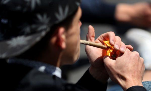 A man smokes marijuana in a file photo in Paris, France, on May 14, 2016. (Kenzo Tribouillard/AFP/Getty Images)