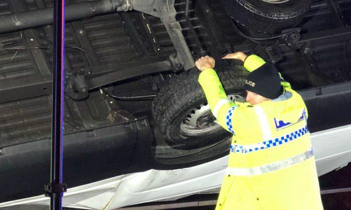 Hero Policeman Stops an Overturned Van Falling Off a Bridge With Driver Trapped Inside