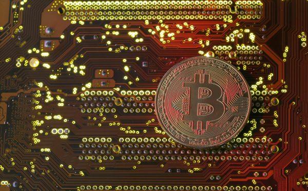 A copy of bitcoin standing on a PC motherboard is seen in this illustration picture, on Oct. 26, 2017. (Dado Ruvic/Reuters)