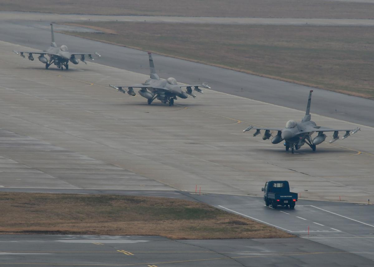 U.S. Air Force F-16 Fighting Falcon fighter aircraft, assigned to the 36th Fighter Squadron, conduct an elephant walk on a taxiway during Exercise VIGILANT ACE 18 at Osan Air Base, Republic of Korea, Dec. 3, 2017. The exercise provides U.S. and RoK forces training to employ Airpower to deter aggression and preserve the armistice, defend the RoK and defeat any attack against the alliance. (U.S. Air Force photo by Staff Sgt. Franklin R. Ramos/Released)