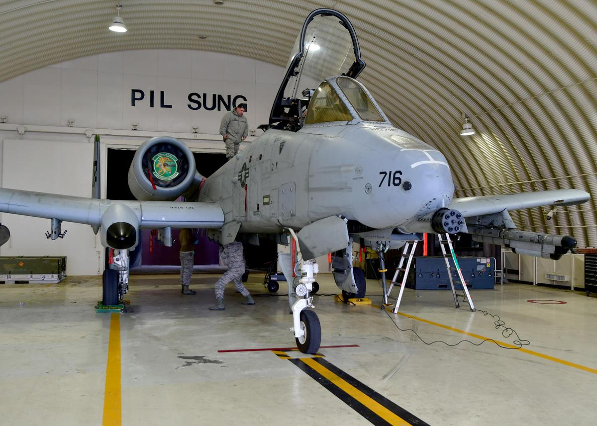Maintainers from the 25th Fighter Squadron prepare an A-10 Thunderbolt II aircraft for live weapons loading during exercise Vigilant Ace 18 at Osan Air Base, Republic of Korea, Dec. 2, 2017.  The A-10 is used for close air support, attacking enemy forces in close proximity to friendly ground forces. (U.S. Air Force photo by Staff Sgt. Franklin R. Ramos/Released)