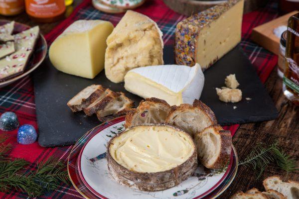 Front: Rush Creek Reserve; center: Fromager d'Affinois; back (L to R): Malvarosa, Stockinghall Cheddar, and Alp Blossom.(Benjamin Chasteen/The Epoch Times)