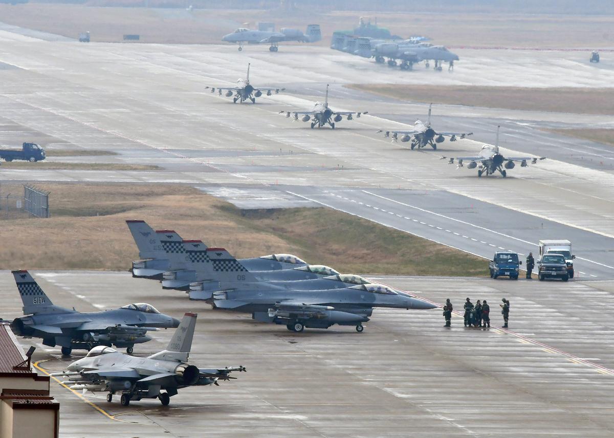 U.S. Air Force F-16 Fighting Falcon fighter aircraft, assigned to the 36th Fighter Squadron, participate in an elephant walk during Exercise VIGILANT ACE 18 at Osan Air Base, Republic of Korea, Dec. 3, 2017. The F-16 is a single-engine air superiority fighter meant to go head-to-head with other fighter jets . (U.S. Air Force photo by Staff Sgt. Franklin R. Ramos/Released)
