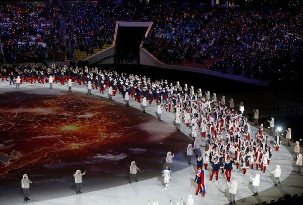 Russia's flag-bearer Alexander Zubkov leads his country's contingent during the opening ceremony of the 2014 Sochi Winter Olympics, on Feb. 7, 2014. (REUTERS/Issei Kato/File Photo)