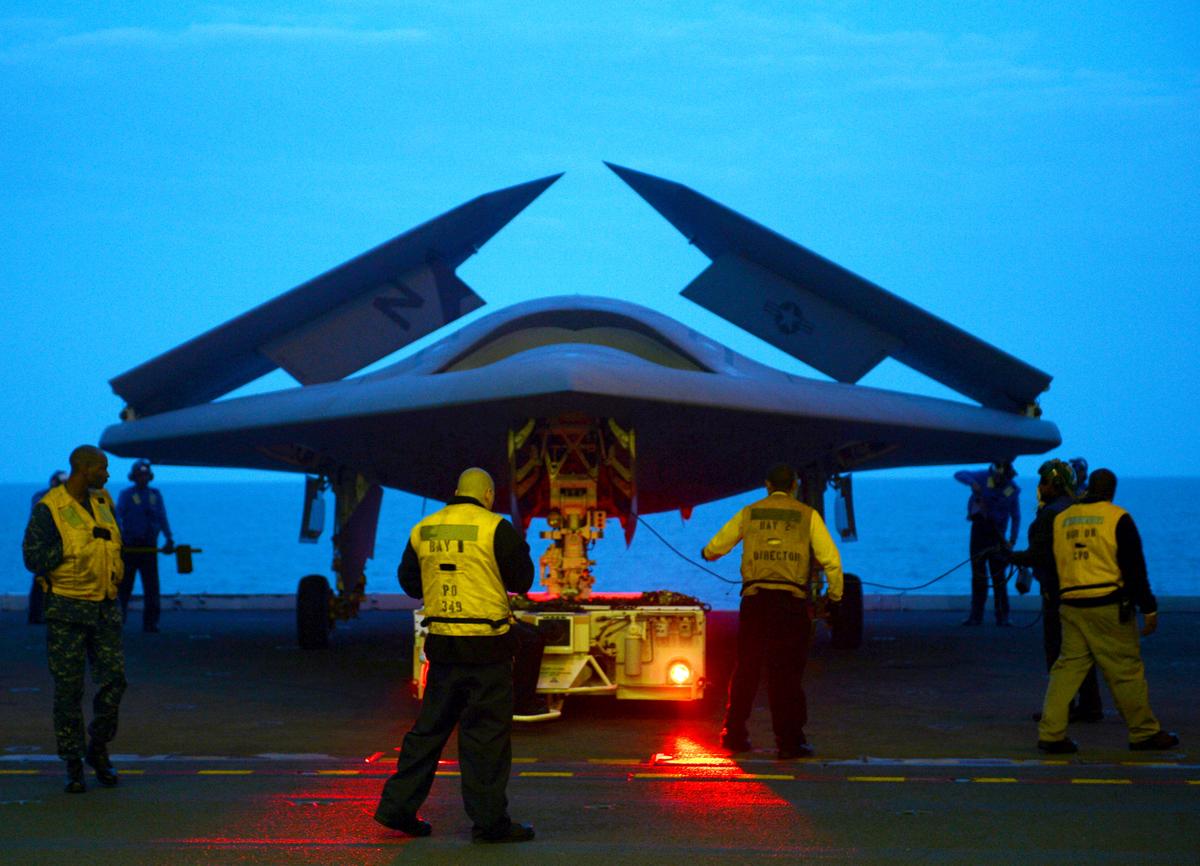 An X-47B military drone aboard USS George H.W. Bush on May 13, 2013 in the Atlantic Ocean. Congress wants high-powered laser drones capable of taking out ICBMs. (Mass Communication Specialist 2nd Class Timothy Walter/U.S. Navy via Getty Images)