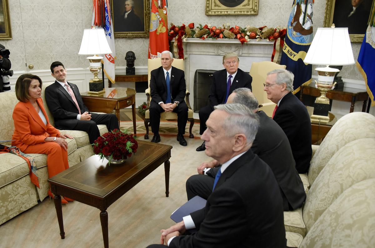  President Donald Trump and Vice President Mike Pence meet with Congressional leadership including House Minority Leader Rep. Nancy Pelosi (D-Calif.), House Speaker Paul Ryan (R-Wis.), Senate Majority Leader Mitch McConnell, and Sen. Chuck Schumer (D-N.Y.), along with U.S. Defense Secretary Jim Mattis in the Oval Office of the White House on Dec. 7, 2017. (Olivier Douliery-Pool/Getty Images)