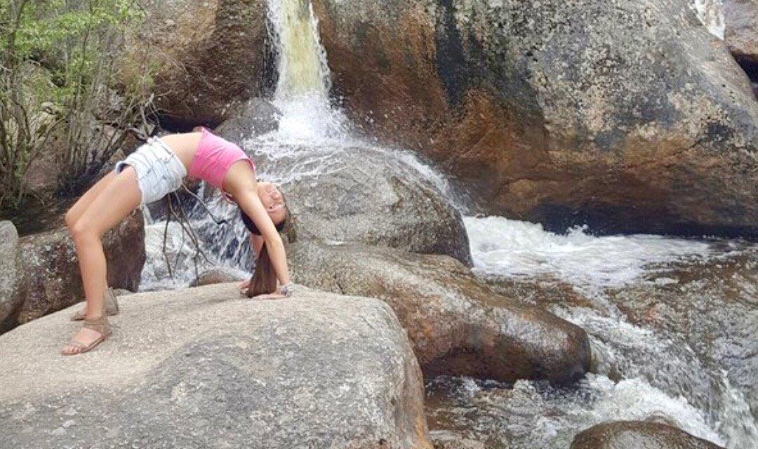 Woman Attempting Yoga Pose Alone on Mountain Pass Falls Into River