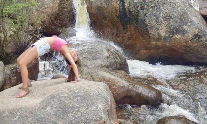 Woman Attempting Yoga Pose Alone on Mountain Pass Falls Into River