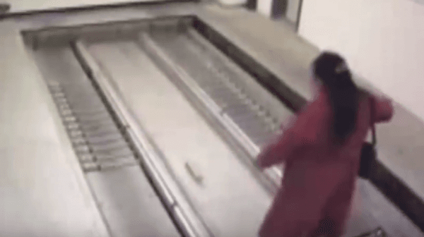 She is then taken down one level on an elevator. (YouTube Screenshot)