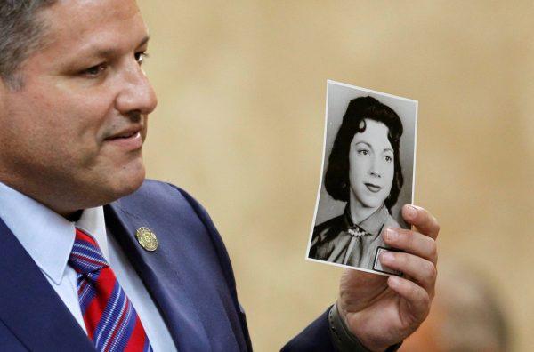 Hidalgo County Assistant District Attorney Michael Garza hold a photograph of Irene Garza in John Bernard Feit's trial for the 1960 murder of Garza in the 92nd state District Court in Edinburg, Texas, U.S., December 7, 2017. (Reuters/Nathan Lambrecht/The Monitor/Pool)