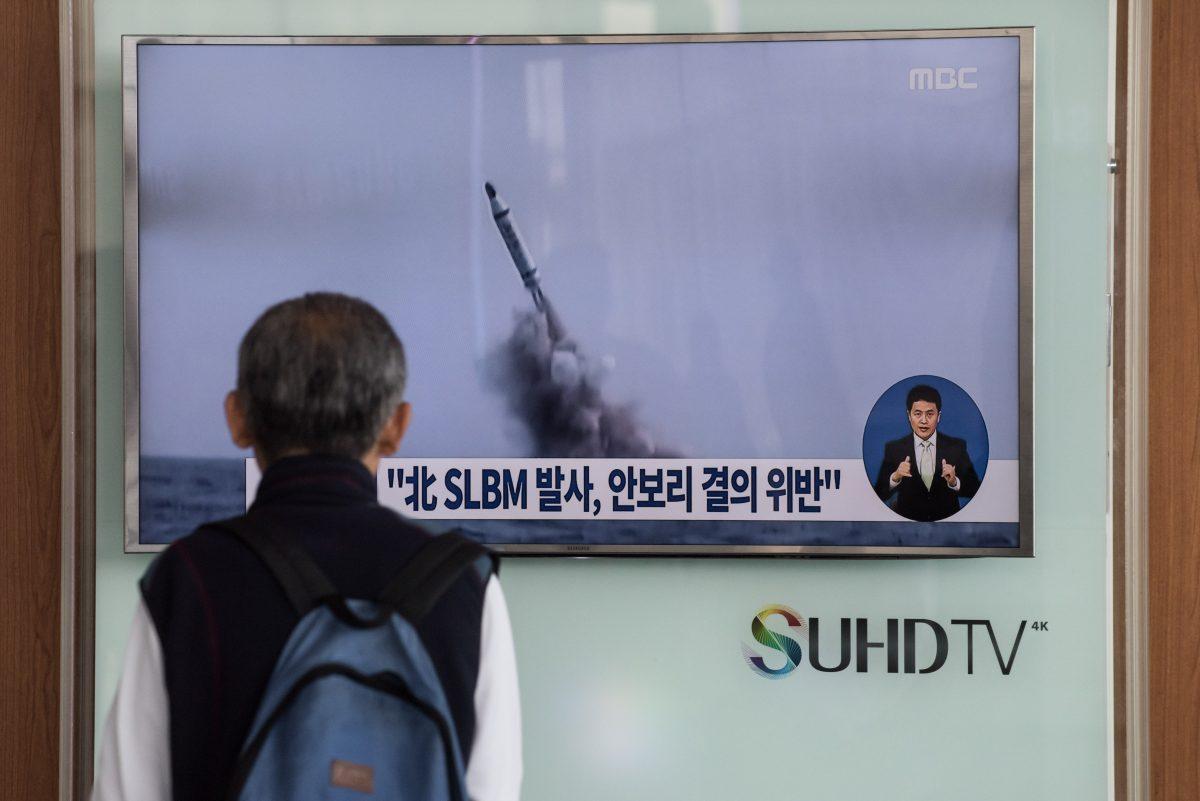 A man watches a television news channel in Seoul showing footage of a North Korean submarine ballistic missile launch on April 24, 2016. North Korean leader Kim Jong-Un hailed a submarine-launched ballistic missile (SLBM) test as an "eye-opening success", state media said on April 24, declaring Pyongyang has the ability to strike Seoul and the U.S. whenever it pleases. (STF/AFP/Getty Images)