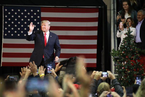 President Donald Trump walks on stage as he holds a rally at the Pensacola Bay Center in Pensacola, Florida, on Dec. 8, 2017. (Joe Raedle/Getty Images)