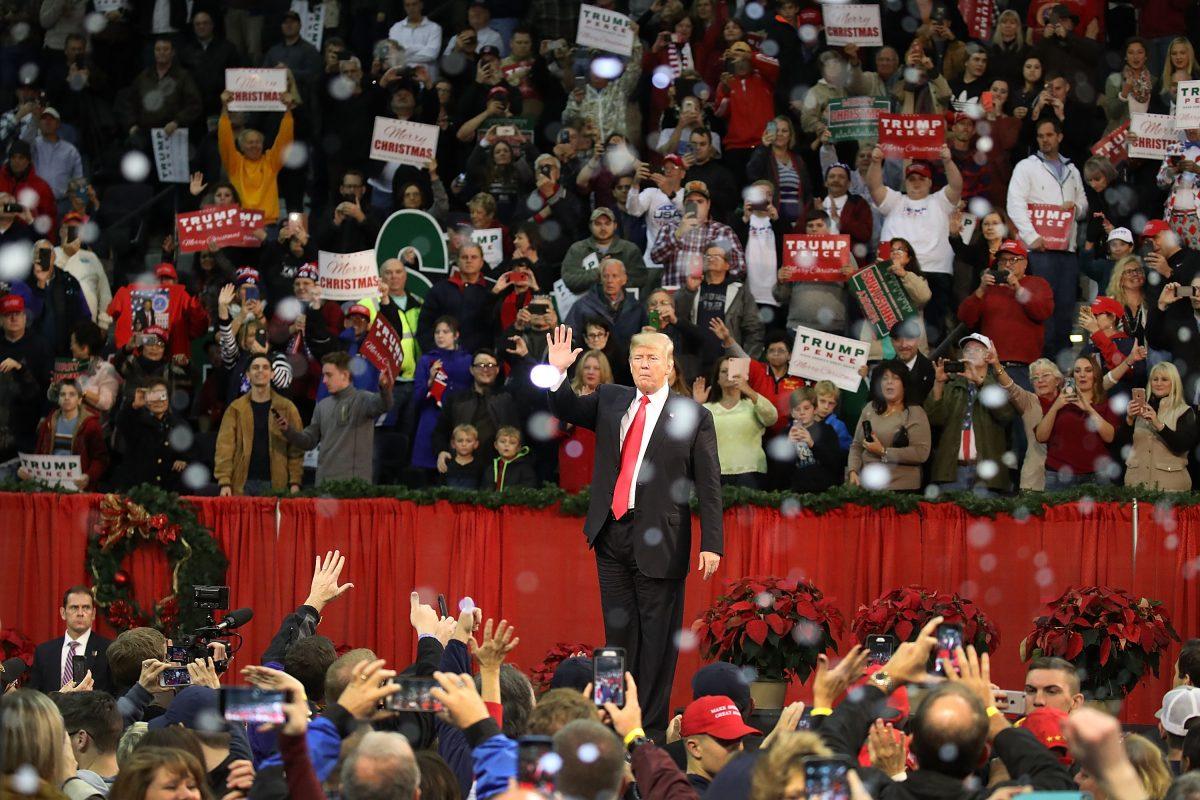 President Donald Trump waves t0 supporters at a rally at the Pensacola Bay Center in Pensacola, Fla., on Dec. 8, 2017. (Joe Raedle/Getty Images)